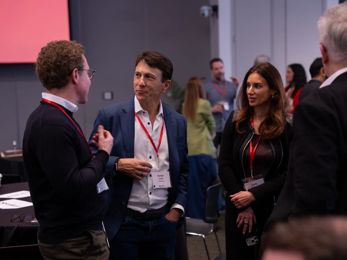Attendees talking between sessions